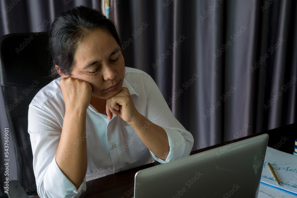 Stress business woman person from hard work, depression in office. Tired and anxious employee female with unhappy at problem job. young businesswoman sitting sad front of laptop computer on desk. Stress business woman person from hard work, depression in office. Tired and anxious employee female with unhappy at problem job. young businesswoman sitting sad front of laptop computer on desk.