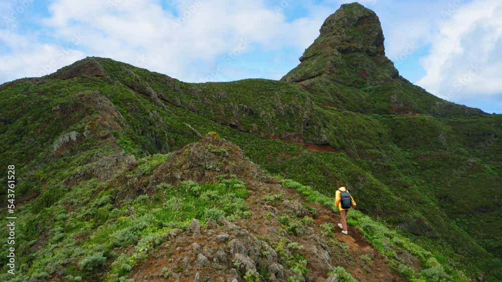 Aerial flight over green mountains. Tourist woman person walking, backpacker, hiking area. Nature landscape. Solo travel. Tenerife Canary Island Spain. Aerial flight over green mountains. Tourist woman person walking, backpacker, hiking area. Nature landscape. Solo travel. Tenerife Canary Island Spain.