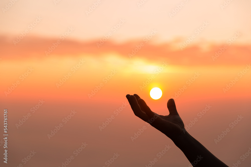 Silhouette of woman hand praying spirituality and religion, female worship to god. banner with copy space. Religious people are humble to God. Christians have hope faith and faith in god.