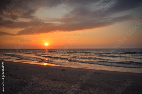 Beautiful summer holiday landscape. Sunset over the Polish sea in Leba.