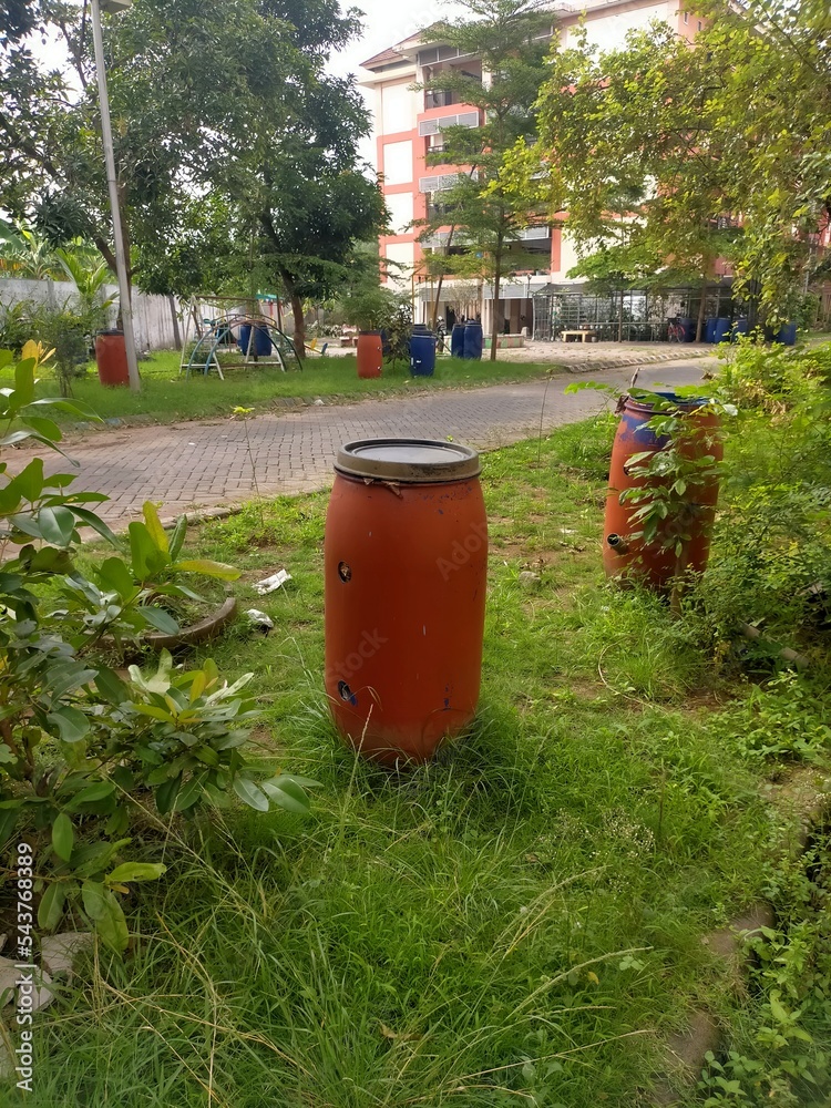 The red garbage for waste in the park The red garbage for waste in the park