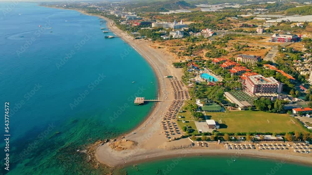ascending view of hotels, pools and beaches surrounded with palm trees, the best place for summer holidays, Okurcalar, Turkey. High quality 4k footage ascending view of hotels, pools and beaches surrounded with palm trees, the best place for summer holidays, Okurcalar, Turkey. High quality 4k footage