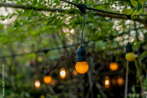 lights on an outdoor cafe on a bokeh background, selective focus