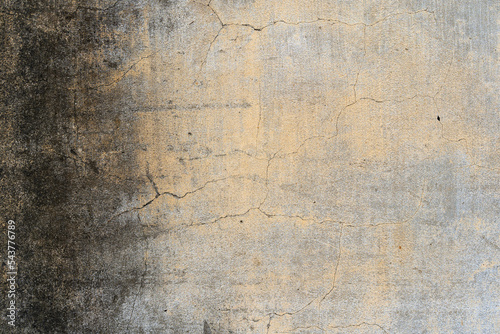 old yellow dirty cement wall or ancient black stain brown paint and cracked concrete table on top view for empty gray floor background or ceiling backdrop and antique construction with dark moldy