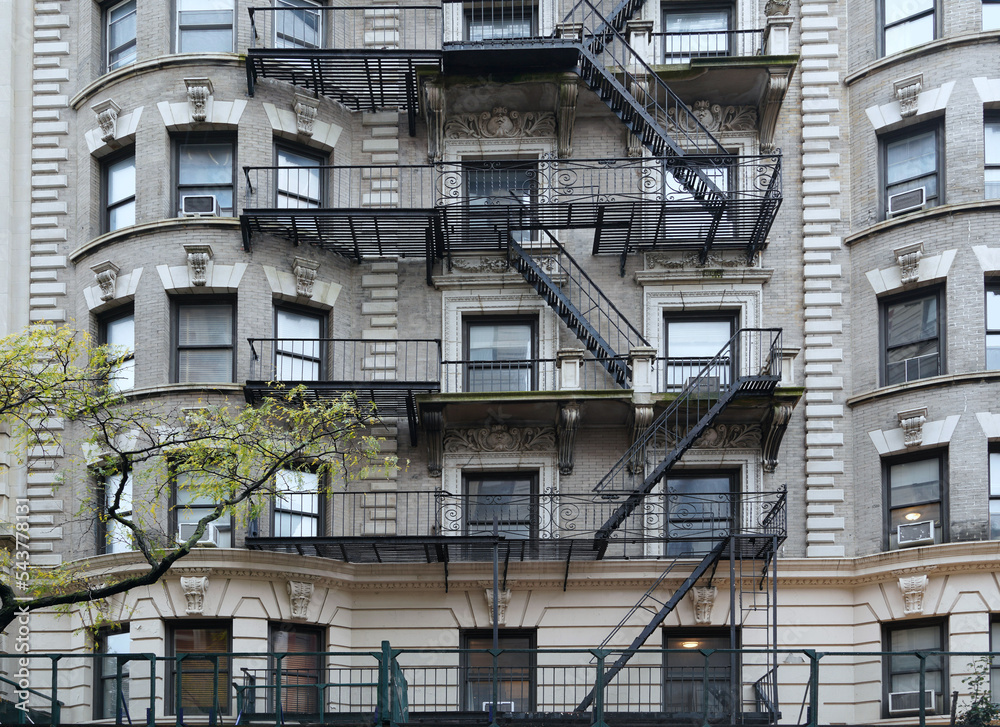 Ornate New York beaux-arts style old apartment building with external fire escape