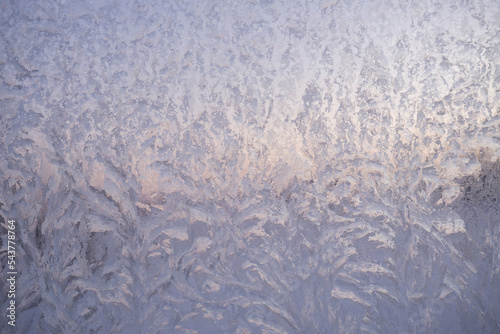 Frosty pattern on the window. Ice on glass, background, texture.