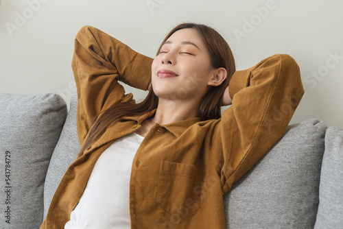 Obraz na płótnie Relaxed serene, happy calm attractive asian young woman peace of mind, relaxing