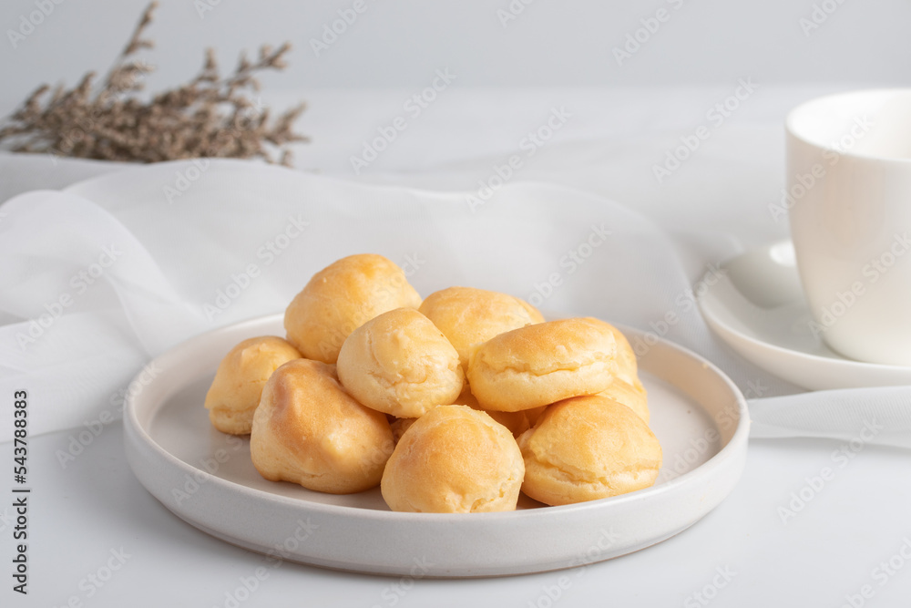 Fresh milk eclair in white plate Fresh milk eclair in white plate