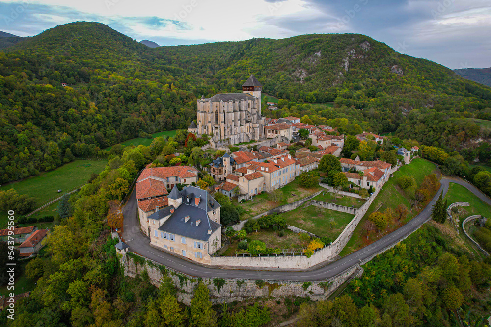 Aerial fly over above Saint-Bertrand-de-Comminges one of the Plus Beaux Villages in the French side of the Pyrenees mountains	