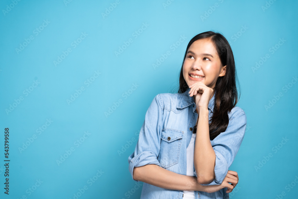 Young lovely Asian woman thinking idea and happy positive pose with copy space as advertising on colorful background as positive post Young lovely Asian woman thinking idea and happy positive pose with copy space as advertising on colorful background as positive post