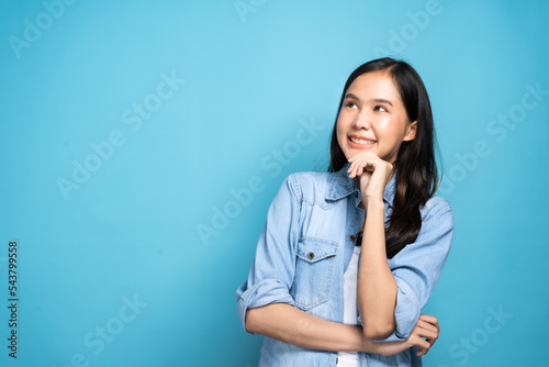 Young lovely Asian woman thinking idea and happy positive pose with copy space as advertising on colorful background as positive post