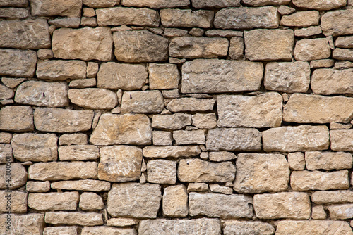 stone wall beige background of house brick horizontal stones wallpaper