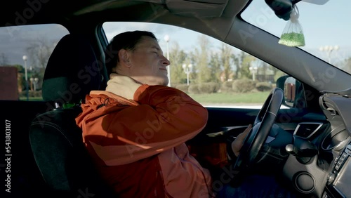 Wallpaper Mural The driver has a neck pain after a long road, he massages his neck with his hand. Driving safety, fatigue. Torontodigital.ca