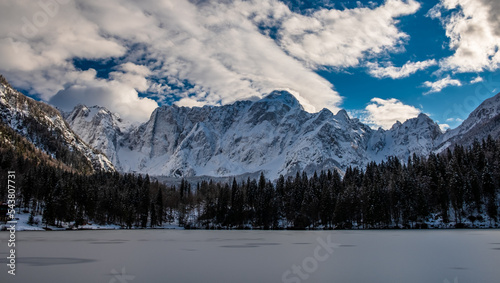 Frozen lake of fusine in a sunny afternoon, Friuli-Venezia Giulia, Italy © zakaz86