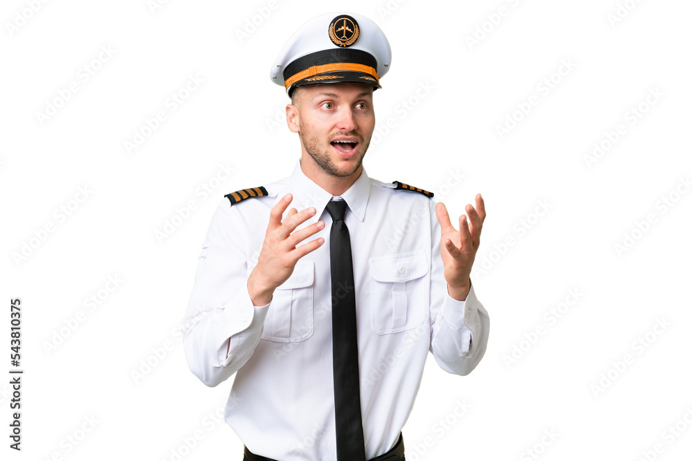 Airplane pilot man over isolated background with surprise facial expression