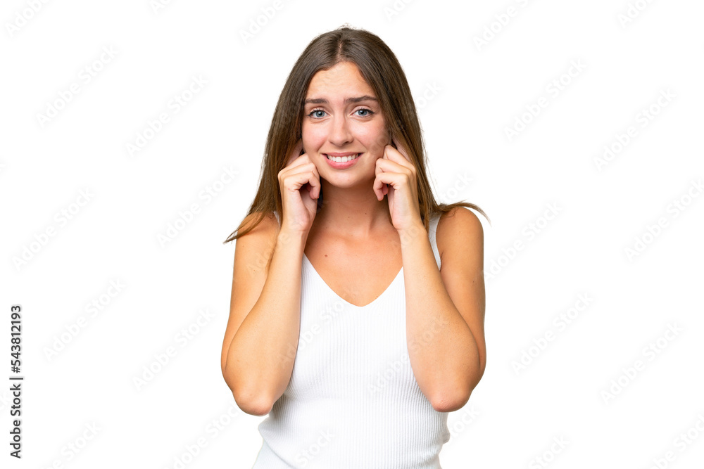 Young pretty woman over isolated background frustrated and covering ears Young pretty woman over isolated background frustrated and covering ears