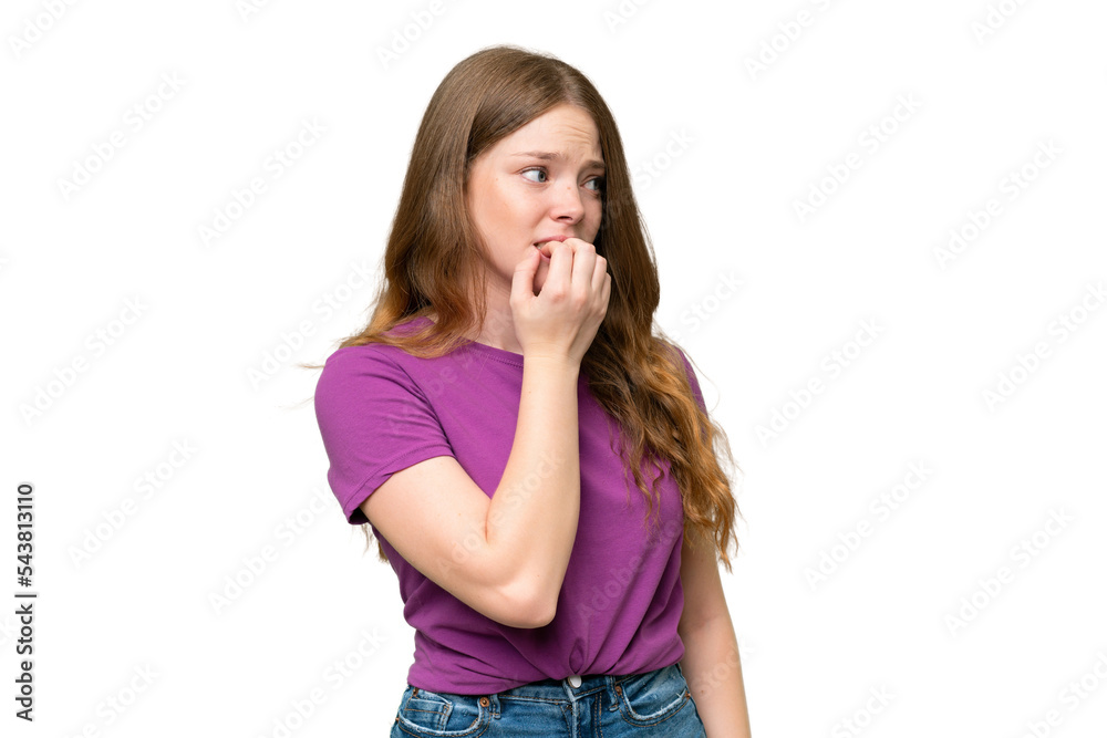 Young pretty woman over isolated background is a little bit nervous Young pretty woman over isolated background is a little bit nervous