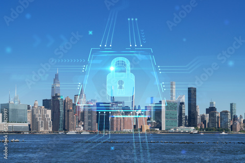 New York City skyline, United Nation headquarters over the East River, Manhattan, Midtown at day time, NYC, USA. The concept of cyber security to protect confidential information, padlock hologram