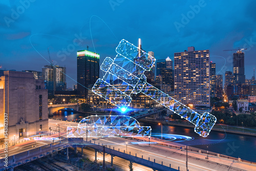 Aerial panoramic cityscape of Philadelphia financial downtown at night time, Pennsylvania, USA. Glowing hologram of legal icons. The concept of law, order, regulations and digital justice.