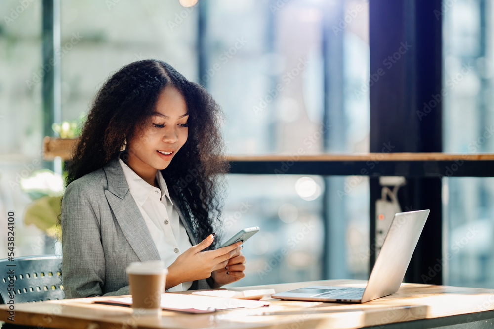 Businesswoman working in the office with working notepad, tablet and laptop documents . Businesswoman working in the office with working notepad, tablet and laptop documents .