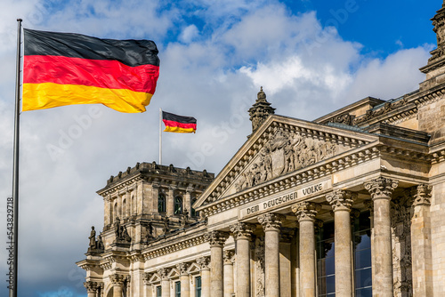 The Reichstag building with German flags  Berlin  Germany