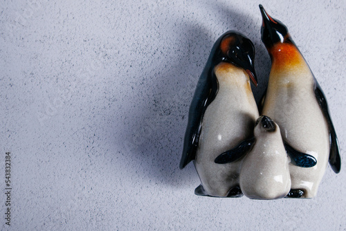 The family consists of three penguins