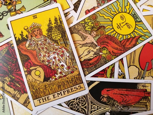 Picture of The Empress tarot card from the original Rider Waite tarot deck with mixed tarot cards in the background