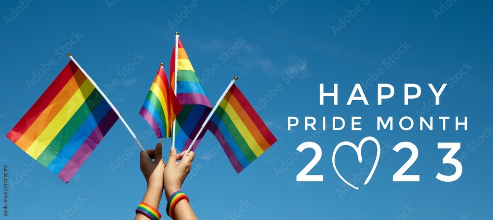'HAPPY PRiDE MONTH 2023' on bluesky and rainbow flags background, concept for lgbtq+ celebrations in pride month, june, 2023.	 - obrazy, fototapety, plakaty 