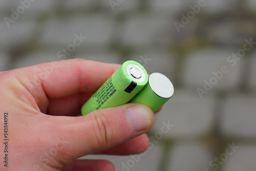 hand holding a battery
