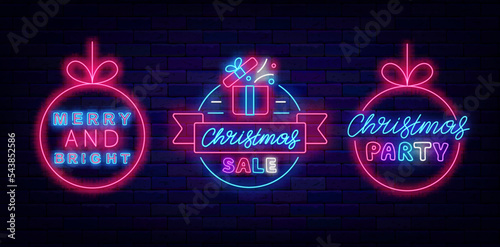 Christmas sale neon signboards. Circle frame with ribbon and gift. Shiny lettering banner. Vector stock illustration