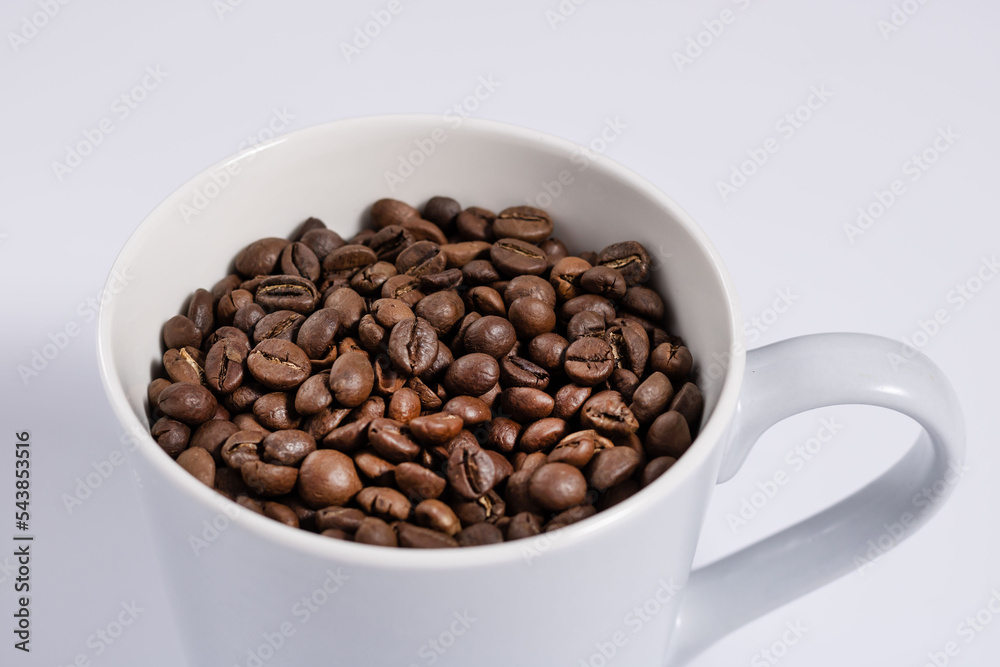 close shot of mug filled with cocoa beans close shot of mug filled with cocoa beans