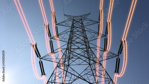 Electricity transmission towers with glowing wires