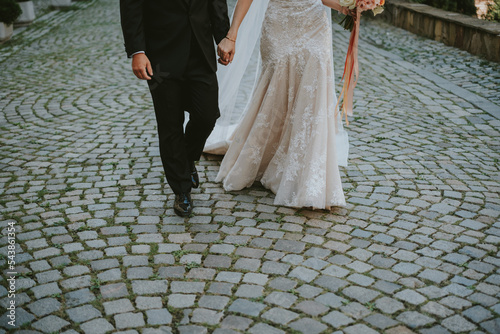Fotobehang bride and groom walking