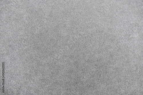 Grey felt texture. Blank abstract background. Closeup view of floor carpet material.
