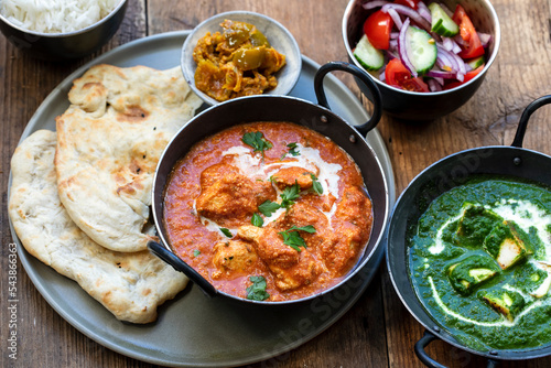 Butter chicken, saag paneer, toamto salad and naan bread