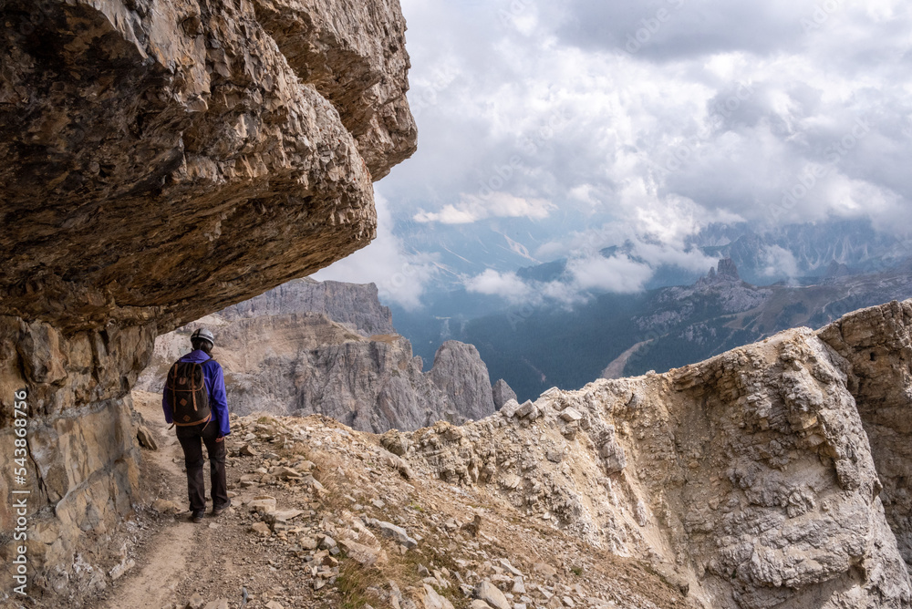 Adventurous hike up to mount Lagazuoi in the Dolomite Alps, view on the Valparola pass, South Tirol in Italy