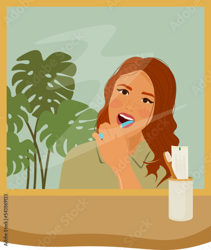 A cute red-haired girl brushes her teeth while looking in the mirror. Vector illustration. The concept of oral hygiene and care.