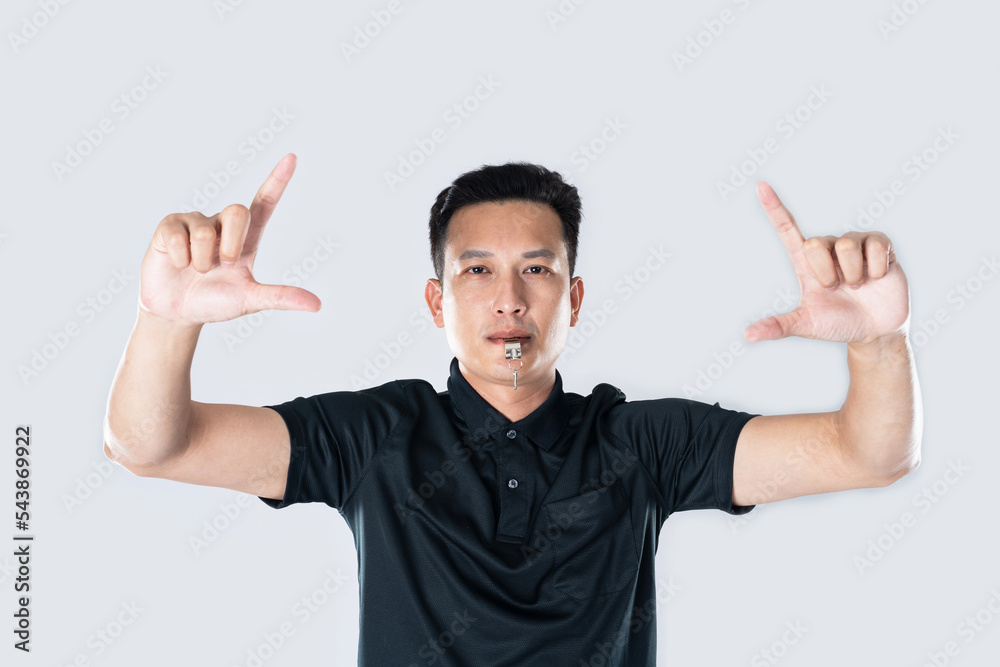 Football referee showing VAR symbol. Football referee showing VAR symbol.