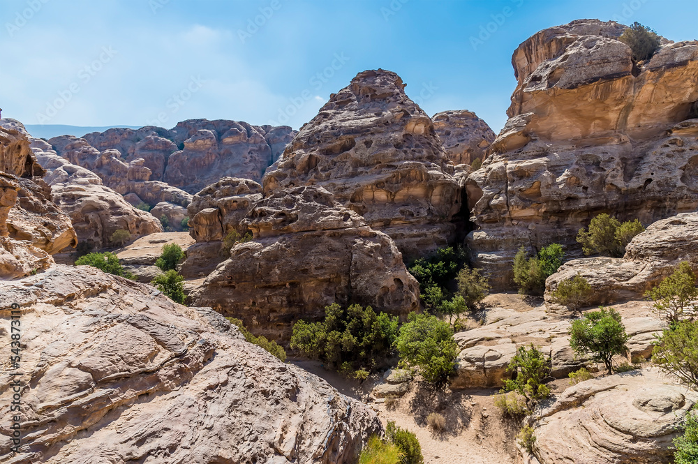 A view across the rocky landscape above the gorge at Little Petra, Jordan in summertime