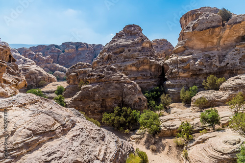 A view across the rocky landscape above the gorge at Little Petra, Jordan in summertime