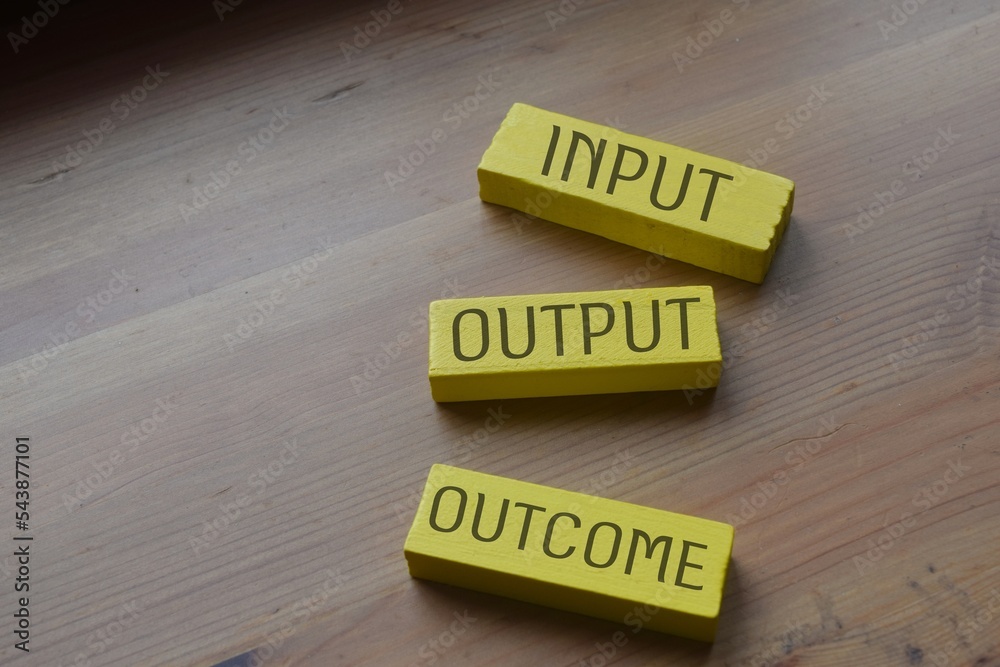 Input Output Outcome wording on a wooden block - obrazy, fototapety, plakaty 