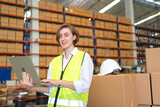 A female worker is working to inspect and pack goods in a warehouse.
