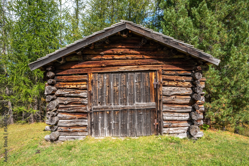 Typical alp with a hay shed in the Dolomite Alps in the Fanes Sennes Prags Nature Park, South Tirol Typical alp with a hay shed in the Dolomite Alps in the Fanes Sennes Prags Nature Park, South Tirol