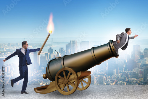 Fototapete Concept of lay-off with businessman and cannon