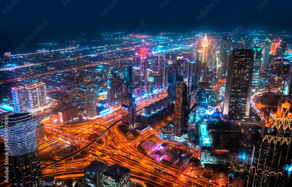Obraz premium Dubai city at night, view with lit up skyscrapers and roads. 