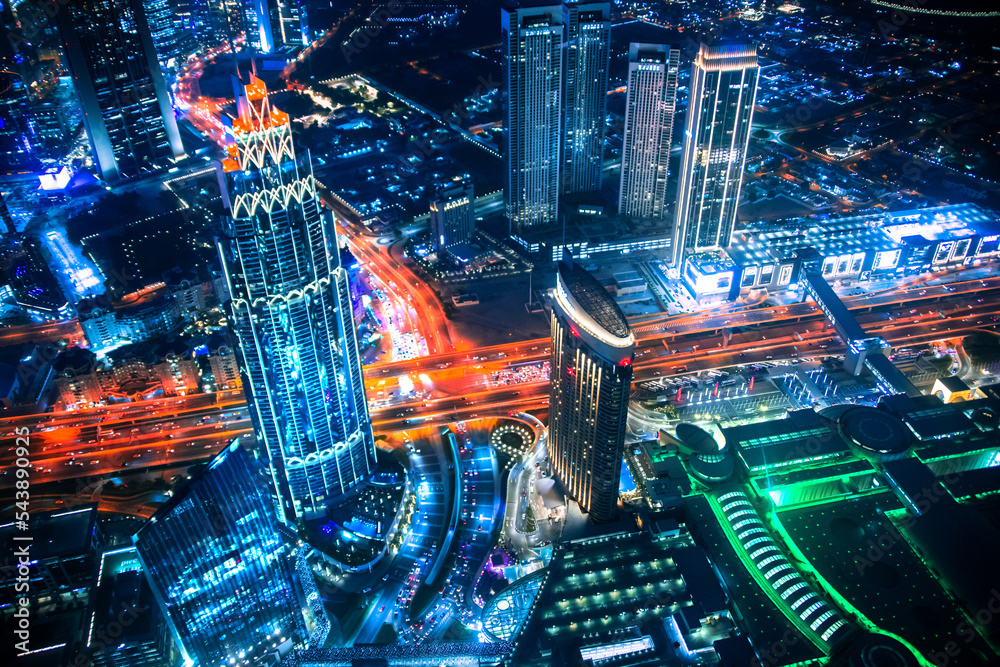 Dubai city at night, view with lit up skyscrapers and roads. Dubai city at night, view with lit up skyscrapers and roads.