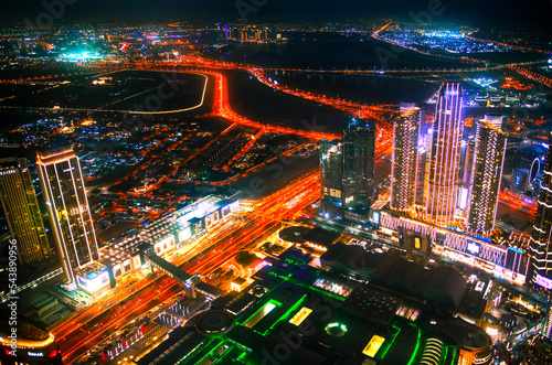  Dubai city at night, view with lit up skyscrapers and roads. UAE, 2022