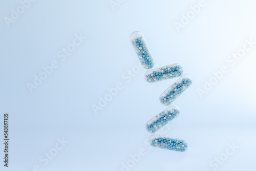 levitating medical capsules on a blue background