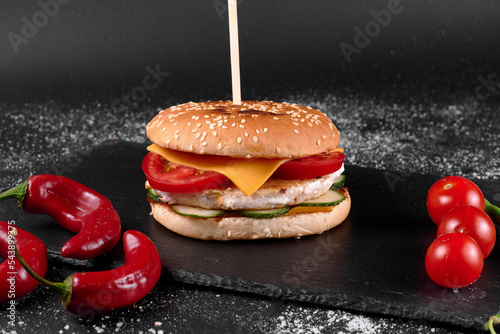 Photo of burger on black board photo