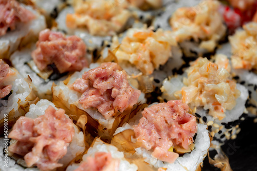 Japanese national dish of sushi, rolls with red fish and salmon chips
